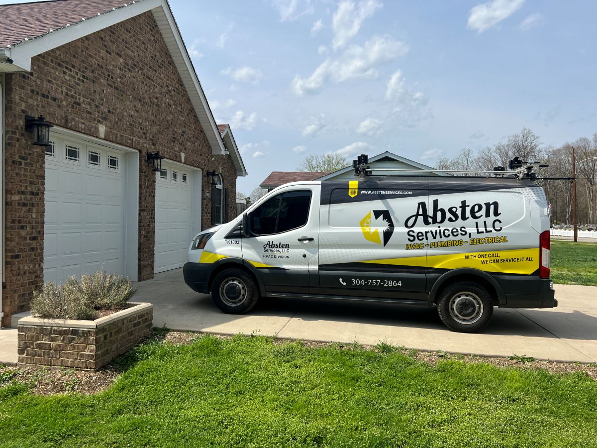 Absten Services plumber repairing a kitchen sink in Winfield, WV