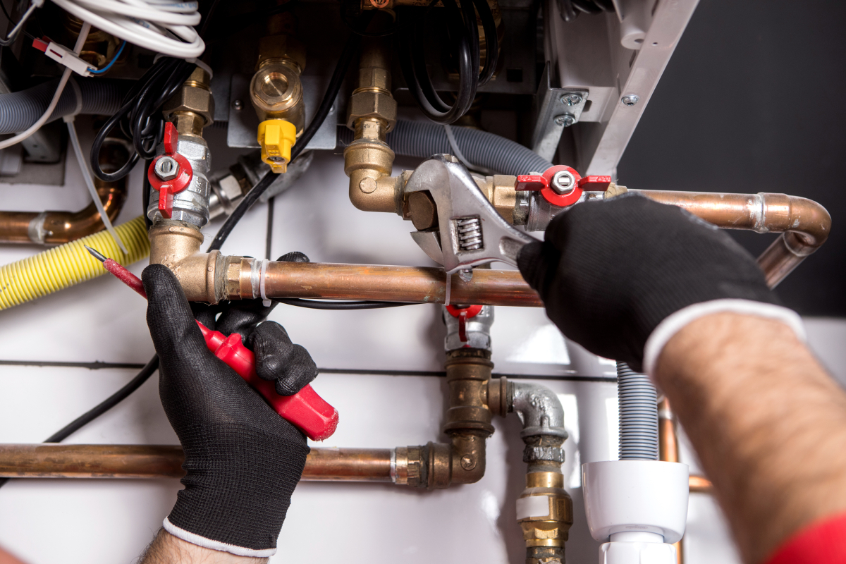 Absten Services HVAC technician repairing an outdoor unit in Winfield, WV
